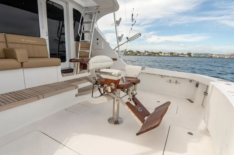 Slide: The Image of 2010 Hatteras GT60 yacht deck with fishing chair and ocean view. - 24