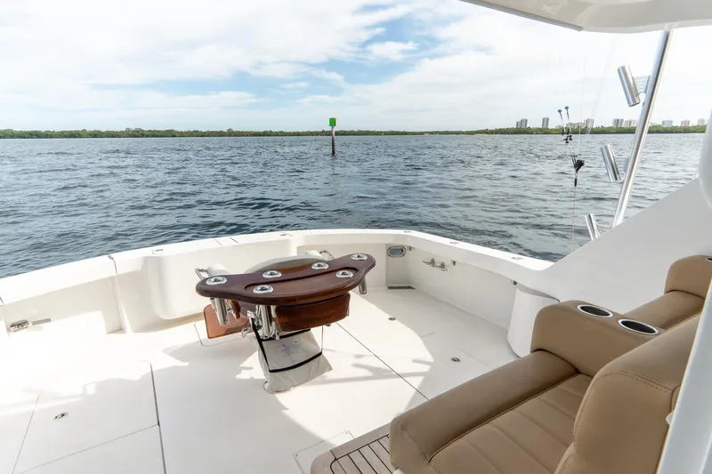 Slide: The Image of 2010 Hatteras GT60 yacht deck with seating and ocean view. - 27