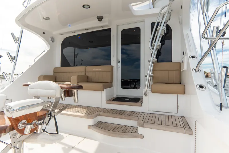 Slide: The Image of 2010 Hatteras GT60 yacht deck with seating and fishing chair. - 29