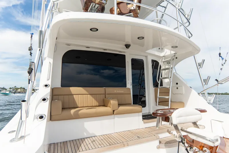 Slide: The Image of 2010 Hatteras GT60 yacht with spacious deck and seating area. - 31