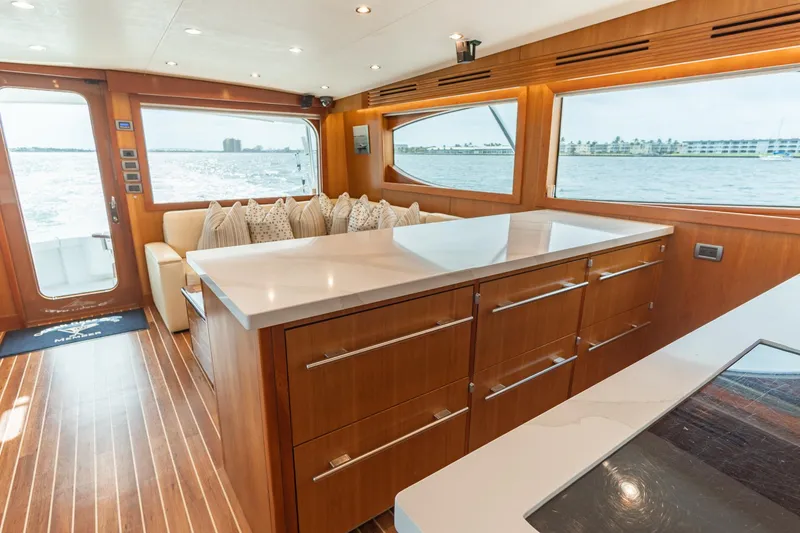 Slide: The Image of Luxurious interior of 2010 Hatteras GT60 yacht with modern wood finishes and ocean view. - 33