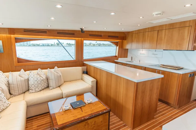 Slide: The Image of Luxurious interior of 2010 Hatteras GT60 yacht with modern kitchen and cozy seating area. - 35