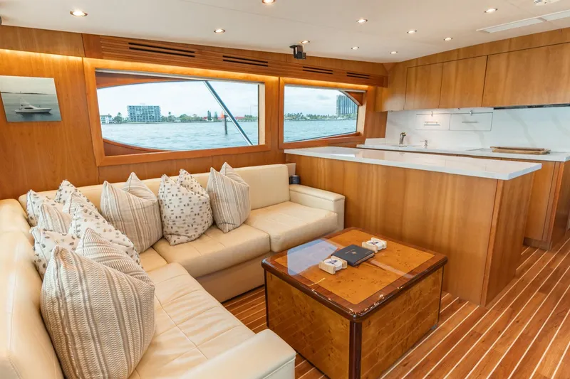 Slide: The Image of Luxurious interior of 2010 Hatteras GT60 yacht with modern kitchen and cozy seating area. - 40