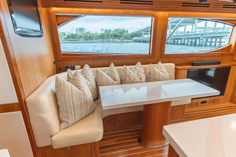 Slide: The Image of Luxurious interior of 2010 Hatteras GT60 yacht with elegant seating and scenic window views. - 42