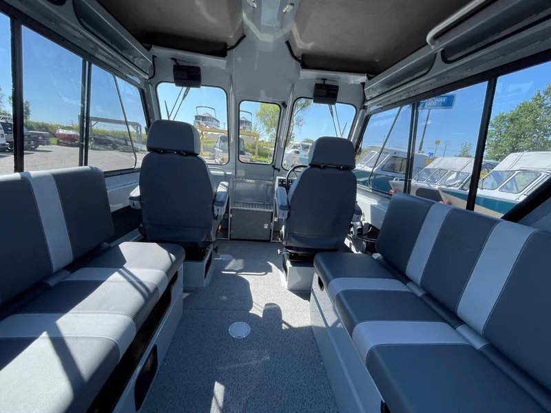 Slide: The Image of Interior of 2025 Hewescraft 210 Sea Runner ET HT boat, featuring spacious seating. - 10