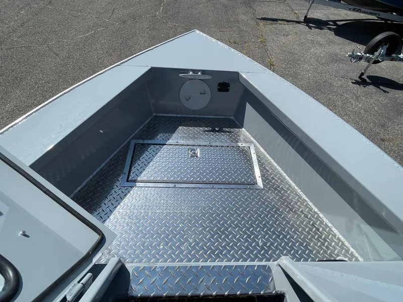 Slide: The Image of 2025 Hewescraft 210 Sea Runner ET HT boat interior with diamond plate flooring. - 21