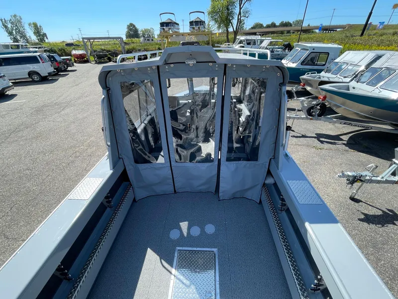 Slide: The Image of 2025 Hewescraft 210 Sea Runner ET HT boat in a dealership lot. - 5