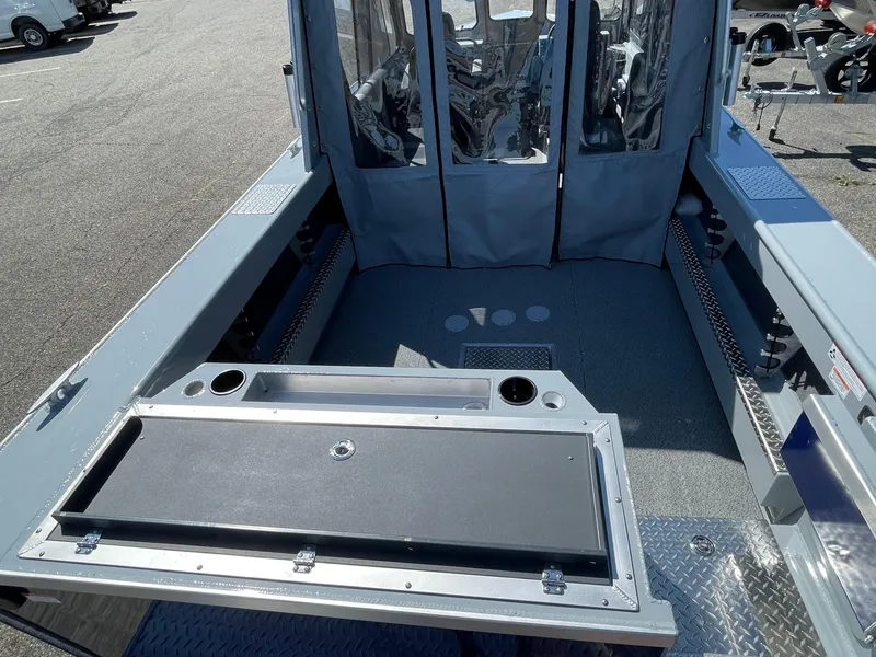 Slide: The Image of 2025 Hewescraft 210 Sea Runner ET HT boat interior with seating and storage. - 6