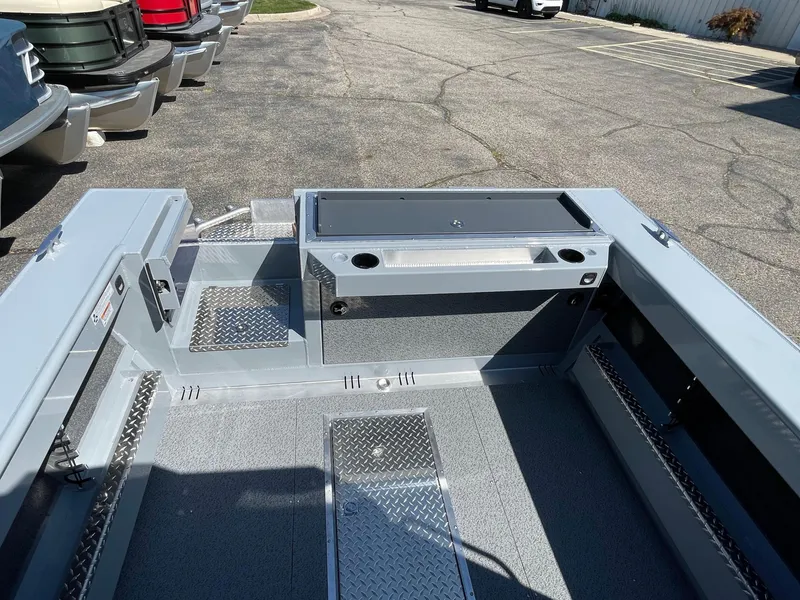 Slide: The Image of 2025 Hewescraft 210 Sea Runner ET HT boat interior with storage and seating. - 8