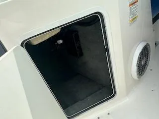 Slide: The Image of Open storage compartment on a 2007 Chaparral 220 SSi boat. - 12