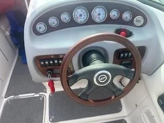 Slide: The Image of 2007 Chaparral 220 SSi boat dashboard with steering wheel and gauges. - 6
