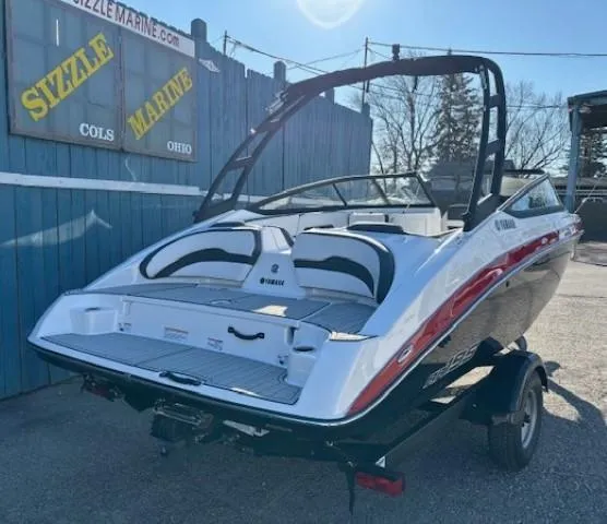 Slide: The Image of 2025 Yamaha AR195 boat on trailer at Sizzle Marine dealership. - 2