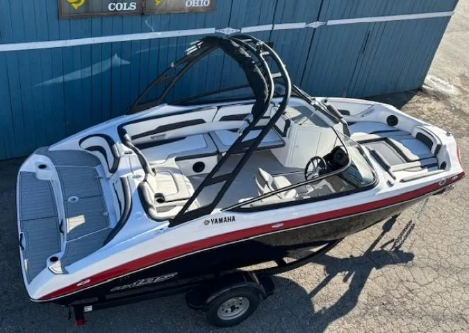 Slide: The Image of 2025 Yamaha AR195 boat with sleek design and modern features, parked on a trailer. - 4