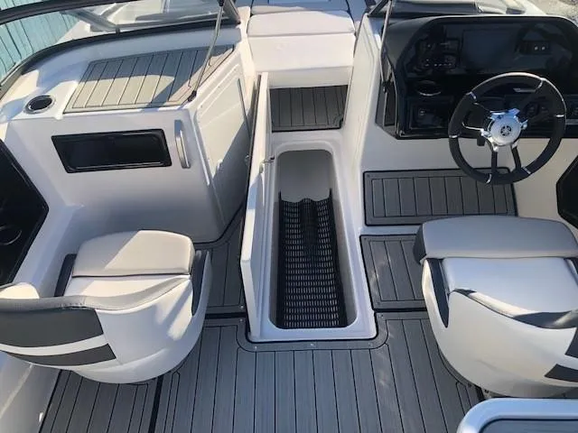 Slide: The Image of 2025 Yamaha Boats 195S interior with seating and steering wheel, showcasing modern design. - 10