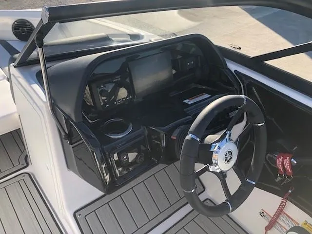Slide: The Image of 2025 Yamaha Boats 195S dashboard with steering wheel and control panel. - 11