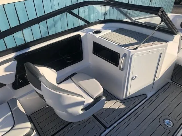 Slide: The Image of 2025 Yamaha Boats 195S interior with sleek seating and modern dashboard design. - 13
