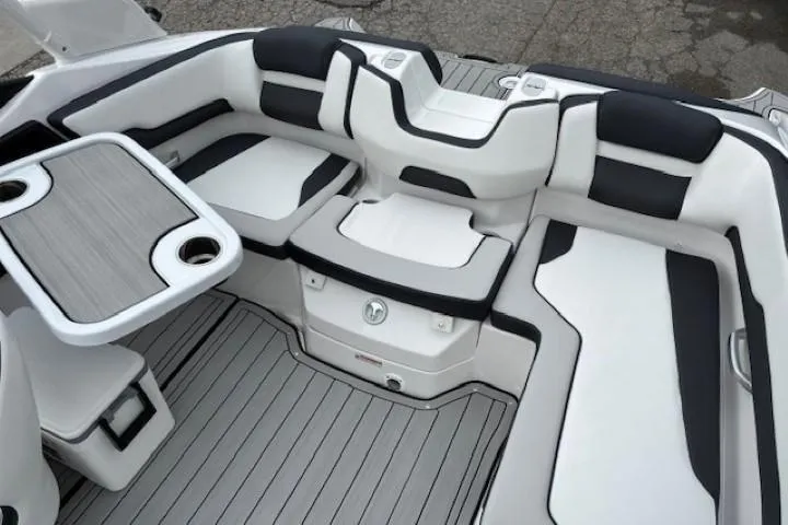 Slide: The Image of 2025 Yamaha Boats 195S interior with sleek seating and table, featuring modern design and comfort. - 15