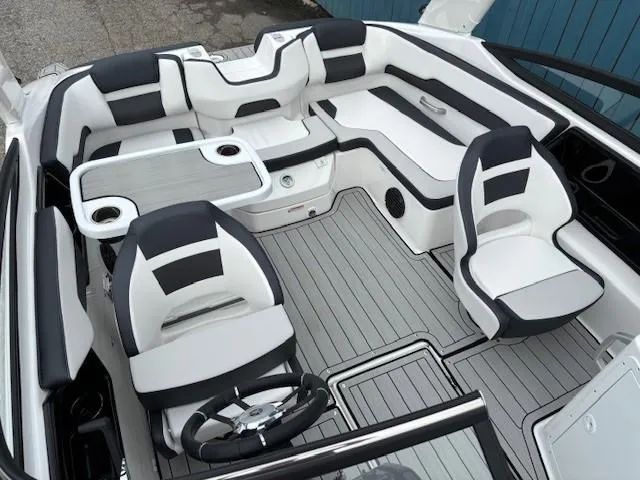 Slide: The Image of 2025 Yamaha Boats 195S interior with sleek seating and modern design. - 16