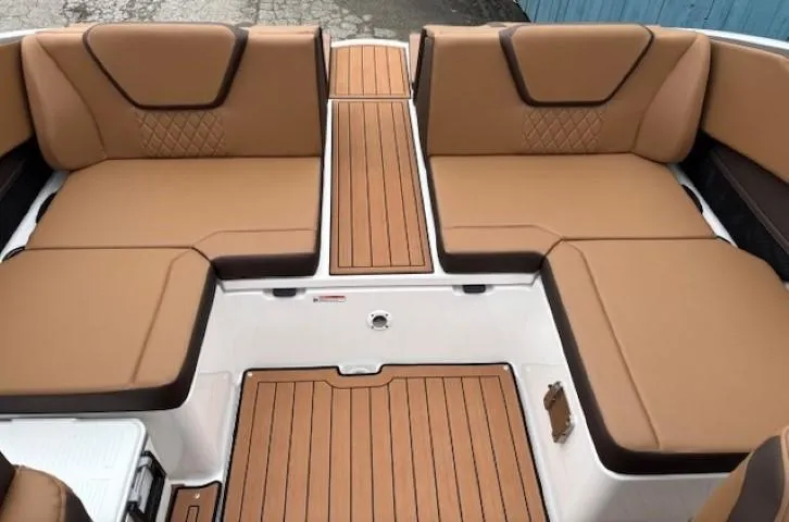 Slide: The Image of 2025 Yamaha Boats 222S interior with tan seating and teak-style flooring. - 14