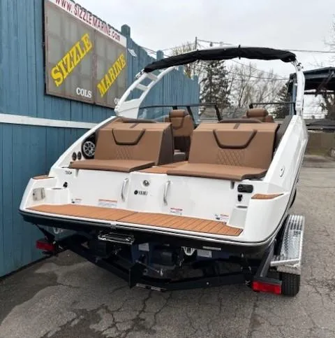 Slide: The Image of 2025 Yamaha Boats 222S, sleek design, brown seating, displayed at Sizzle Marine dealership. - 4