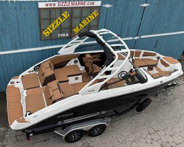 Slide: The Image of 2025 Yamaha Boats 222S on trailer, displayed at Sizzle Marine dealership. - 6