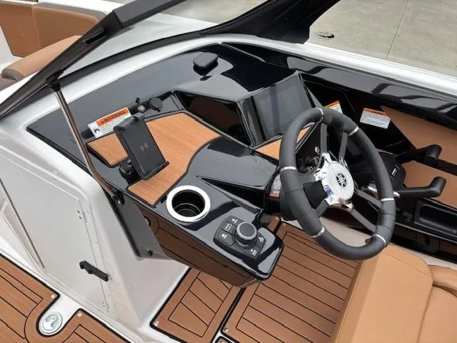 Slide: The Image of 2025 Yamaha Boats 222S dashboard with modern controls and sleek design. - 9