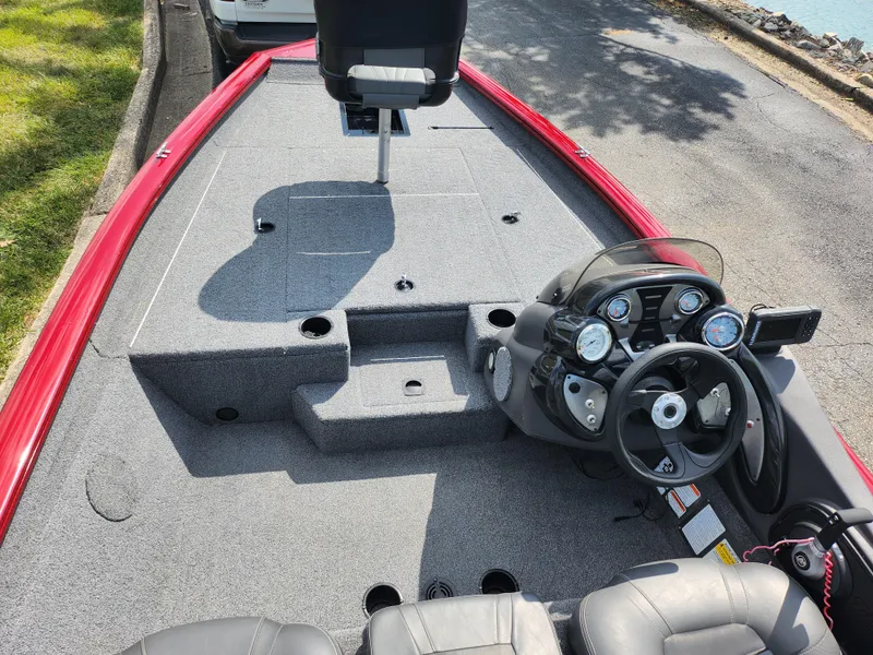 Slide: The Image of 2020 Tracker Pro Team 175 TXW boat interior with steering console and seating. - 10