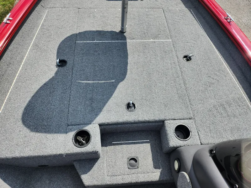 Slide: The Image of 2020 Tracker Pro Team 175 TXW boat deck with gray carpet and storage compartments. - 13