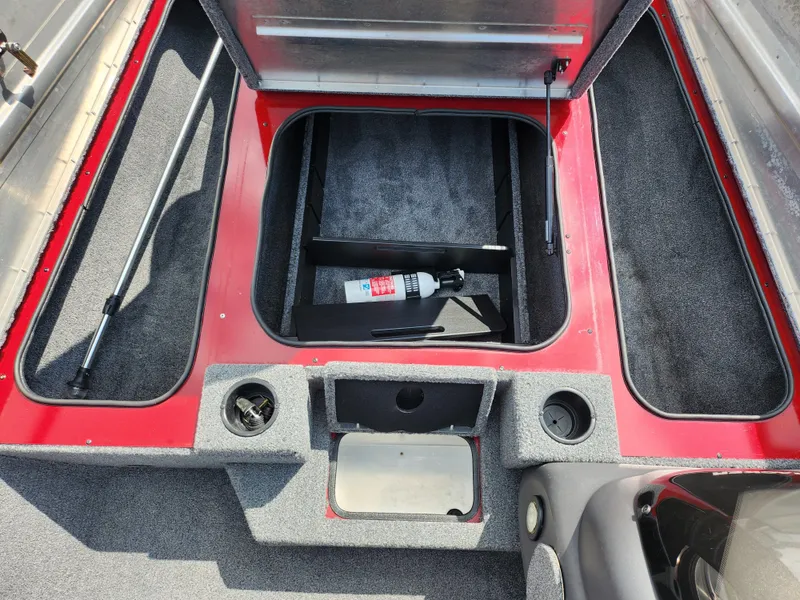 Slide: The Image of 2020 Tracker Pro Team 175 TXW boat interior with storage compartment and fire extinguisher. - 14