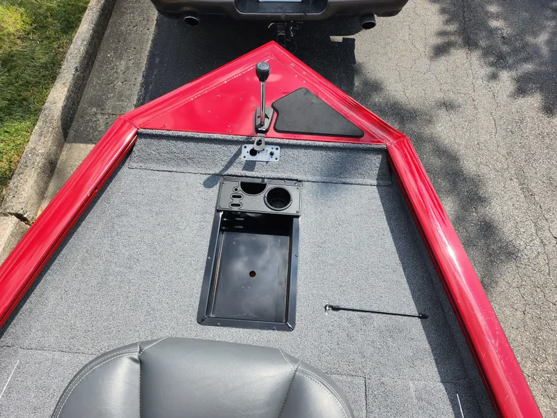 Slide: The Image of 2020 Tracker Pro Team 175 TXW boat, red deck, gray interior, parked on street. - 15