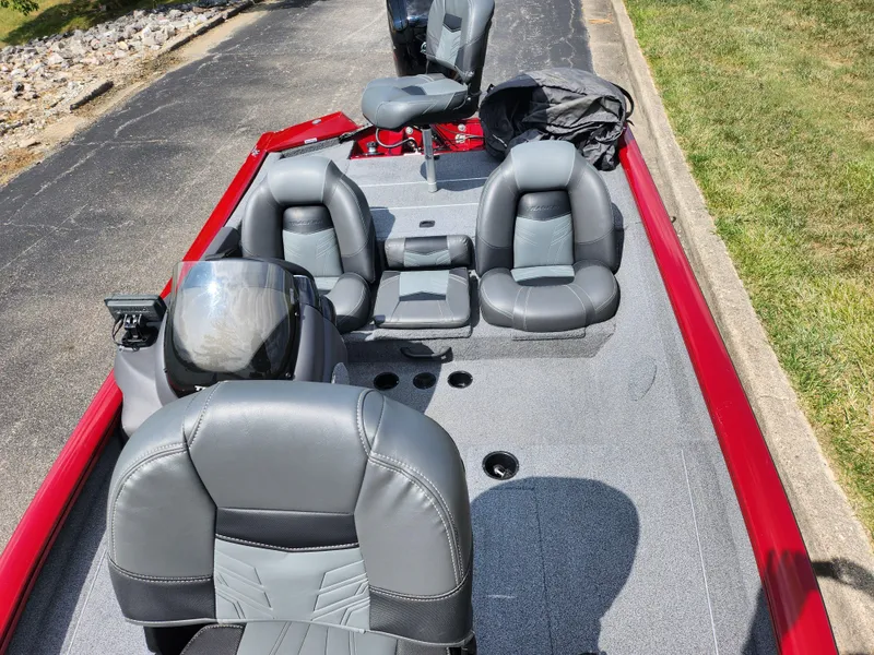 Slide: The Image of 2020 Tracker Pro Team 175 TXW boat interior with gray seating and red accents. - 17