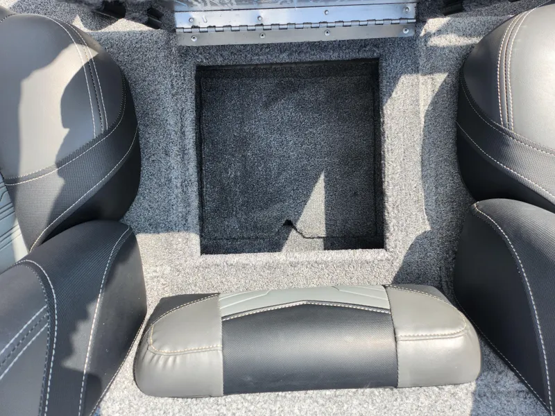 Slide: The Image of 2020 Tracker Pro Team 175 TXW boat interior with gray carpet and seating. - 19