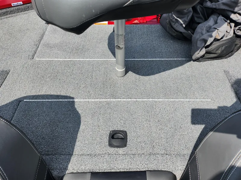 Slide: The Image of 2020 Tracker Pro Team 175 TXW boat interior with gray carpet and seating. - 20