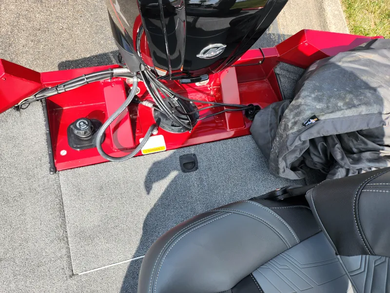 Slide: The Image of 2020 Tracker Pro Team 175 TXW boat interior with motor and seating. - 21