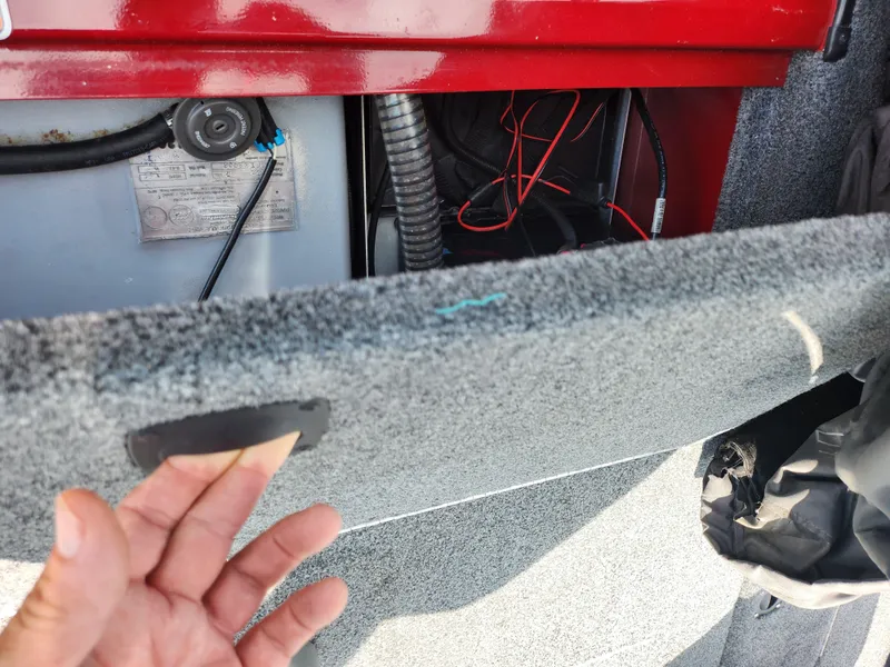 Slide: The Image of 2020 Tracker Pro Team 175 TXW boat interior with wiring and storage compartment. - 22