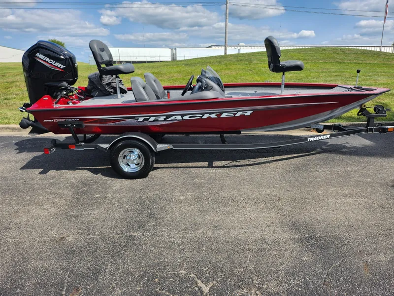Slide: The Image of 2020 Tracker Pro Team 175 TXW boat on trailer, red and black design, parked outdoors. - 4