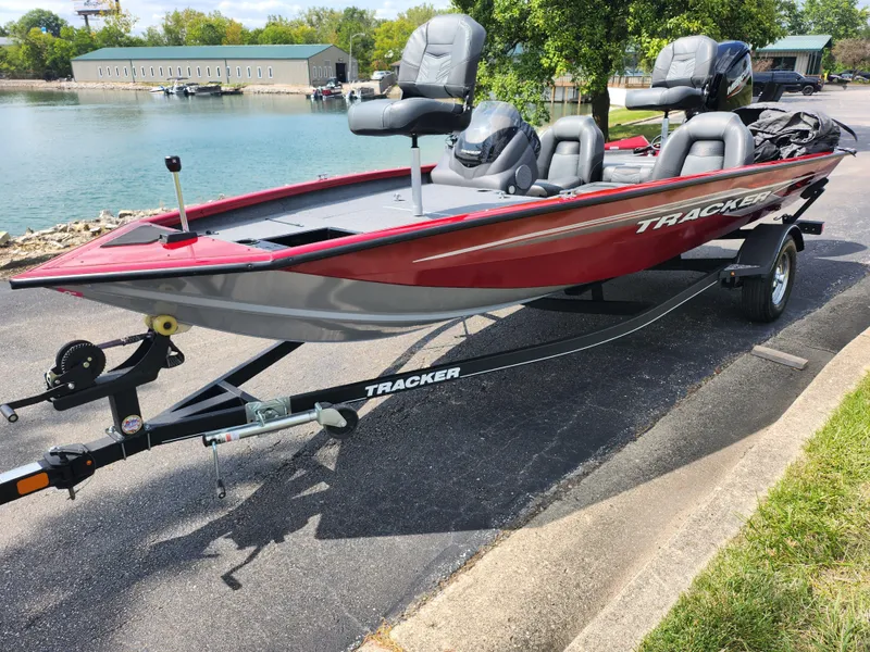 Slide: The Image of 2020 Tracker Pro Team 175 TXW boat on trailer by a lake. - 8