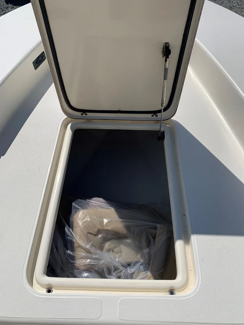 Slide: The Image of Open storage compartment on 2008 Scout 221 Winyah Bay boat. - 12