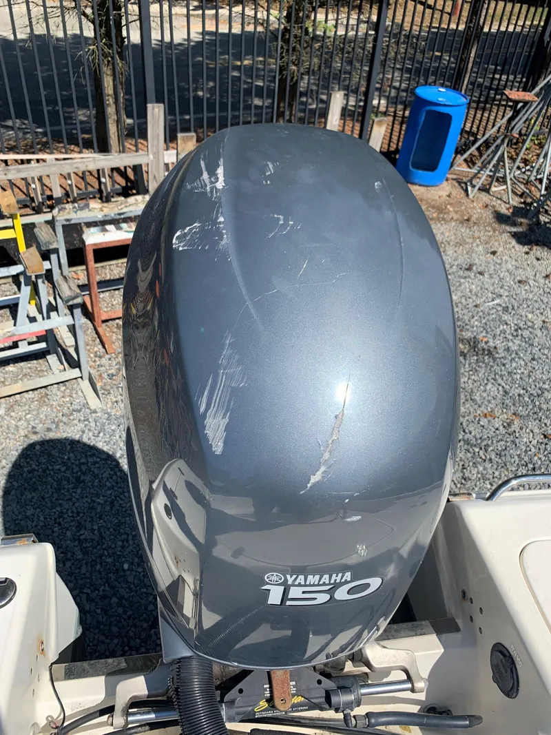 Slide: The Image of Yamaha 150 outboard motor on 2008 Scout 221 Winyah Bay boat, showing scratches. - 18
