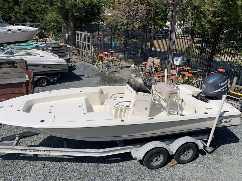 Slide: The Image of 2008 Scout 221 Winyah Bay boat on trailer, parked outdoors. - 2