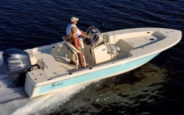 Slide: The Image of 2008 Scout 221 Winyah Bay boat cruising on water with Yamaha engine. - 20