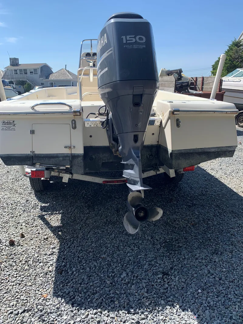 Slide: The Image of 2008 Scout 221 Winyah Bay boat with Yamaha 150 outboard motor on gravel. - 6