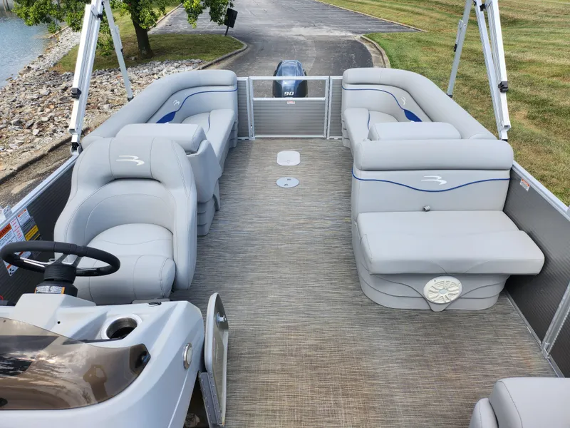 Slide: The Image of 2022 Bennington S 22 SSR pontoon boat with spacious seating and modern design. - 12