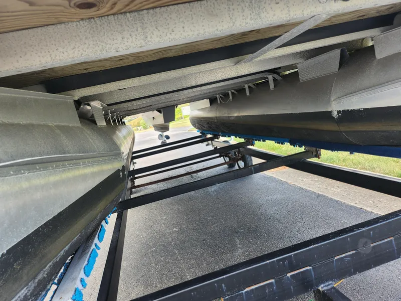 Slide: The Image of Underneath view of a 2022 Bennington S 22 SSR pontoon boat on a trailer. - 8