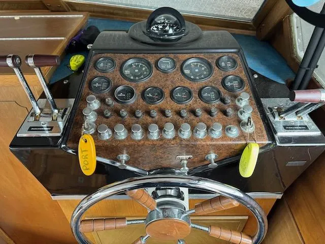 Slide: The Image of 1974 Tollycraft 40 Tri-Cabin helm with vintage controls and gauges. - 24