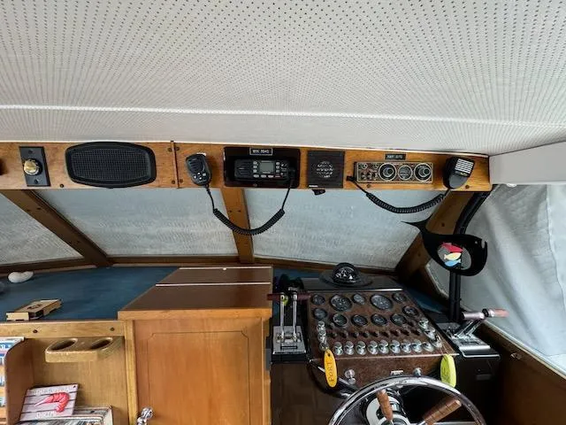 Slide: The Image of 1974 Tollycraft 40 Tri-Cabin helm with vintage controls and navigation equipment. - 25