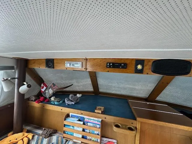 Slide: The Image of Interior of 1974 Tollycraft 40 Tri-Cabin with nautical decor and wooden accents. - 26