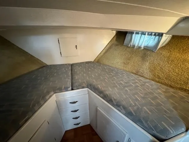 Slide: The Image of 1974 Tollycraft 40 Tri-Cabin interior with V-berth and storage drawers. - 30