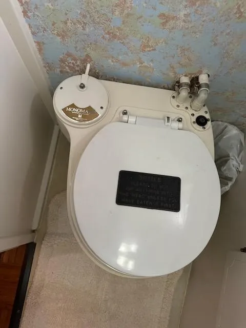 Slide: The Image of Marine toilet in 1974 Tollycraft 40 Tri-Cabin boat bathroom. - 36