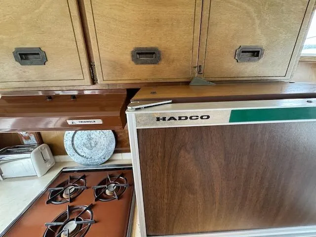 Slide: The Image of Vintage Tollycraft 40 Tri-Cabin kitchen with Hadco fridge and stove, 1974 model. - 40